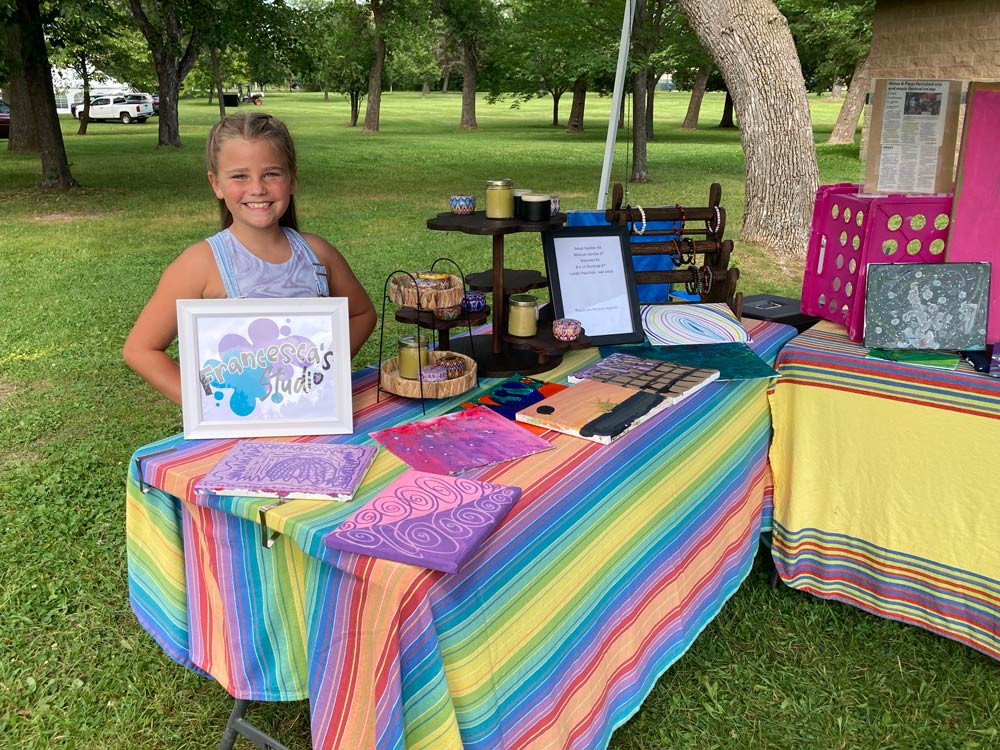 booth with girl and mines and pines festival in Hibbing, Minnesota